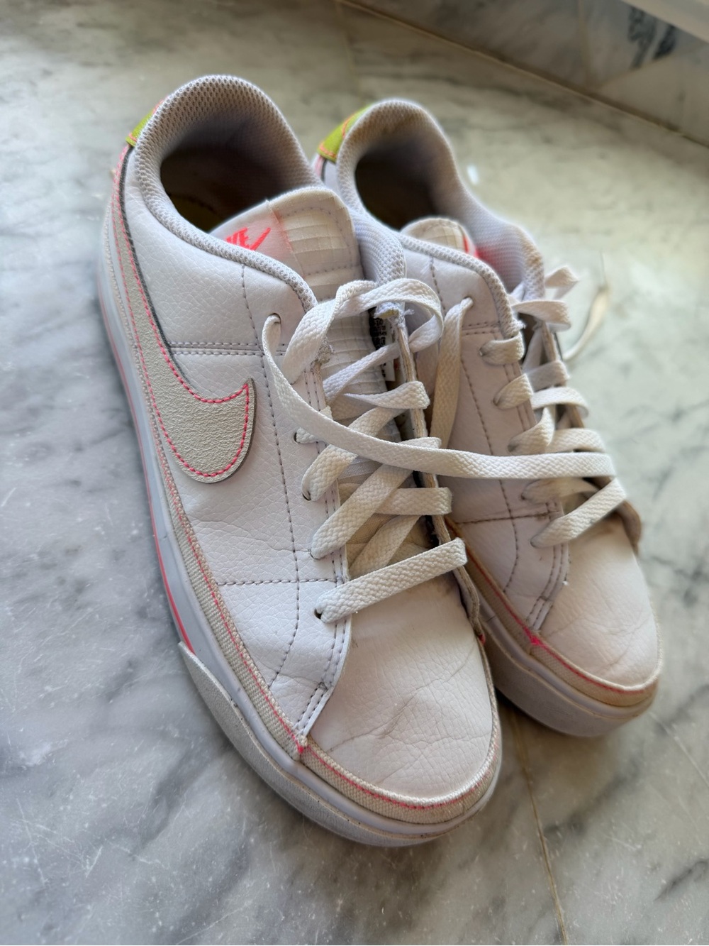Nike White Athletic Shoes with Pink Accent